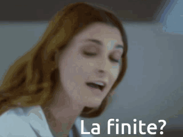 a close up of a woman 's face with the words la finite on the bottom