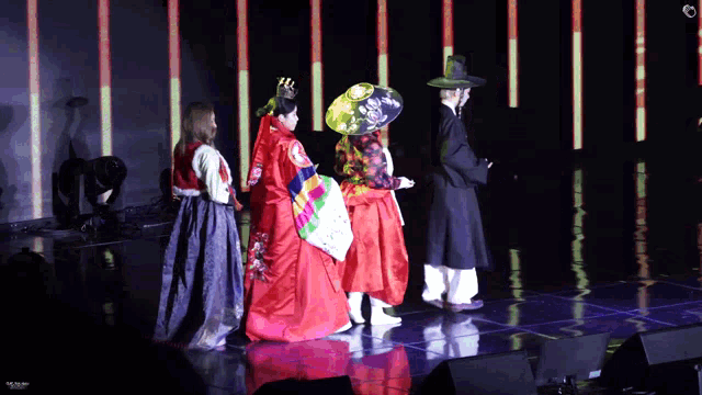 a group of people dressed in traditional korean clothing