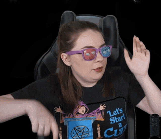 a woman wearing sunglasses and a black shirt that says let 's start a city