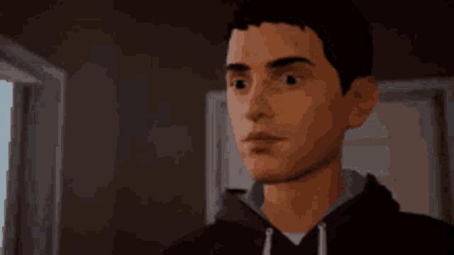 a man in a black hoodie is looking at something