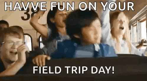 a group of people are riding on a school bus and laughing .
