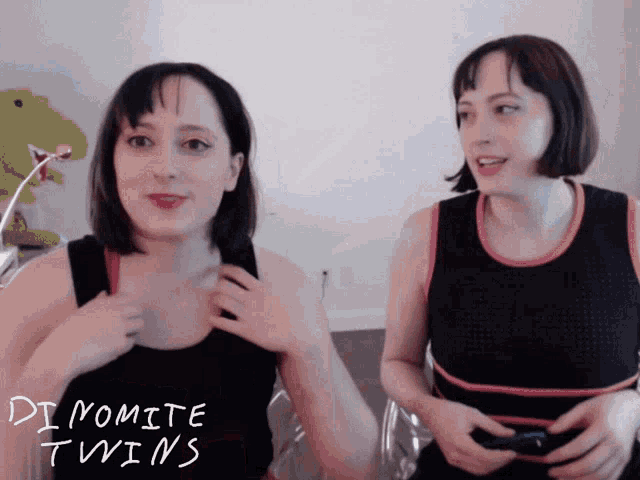 two women are standing next to each other and the words dynamite twins are written on the bottom