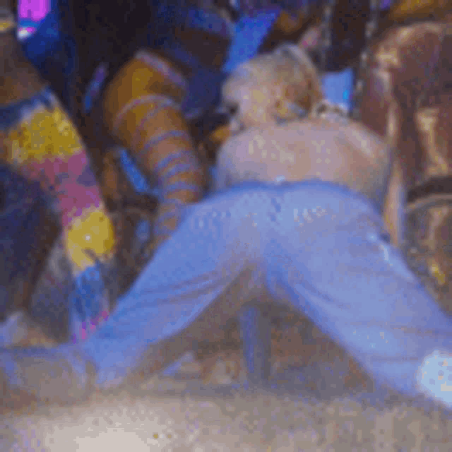 a blurry picture of a person 's butt in a blue jeans