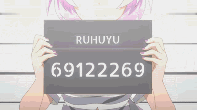 a girl holding up a sign that says ruhuyu