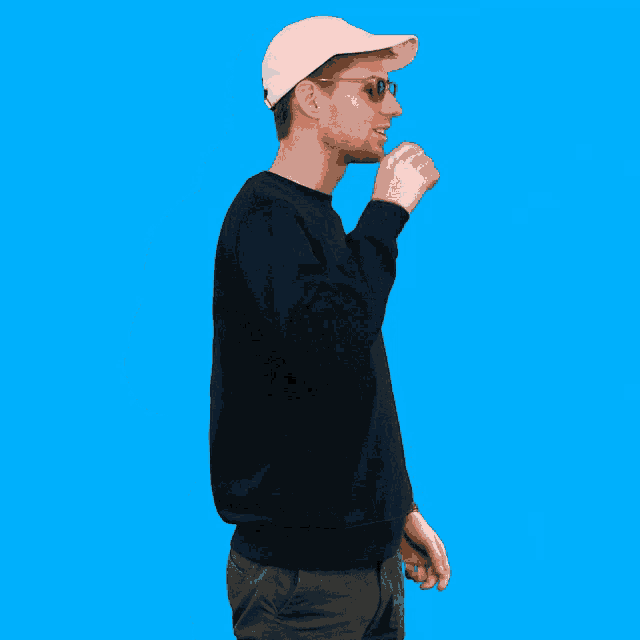 a man wearing a go spooky sweatshirt and a white hat