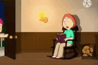 a woman is sitting in a rocking chair reading a book in a room .