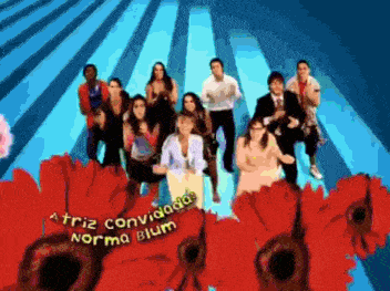 a group of people are standing in front of red flowers and the name norma blum is on the bottom