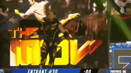 a wrestling match is being shown on a screen that says the miz