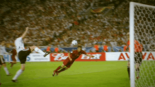 a soccer game is being played in front of a banner that says " bwin "