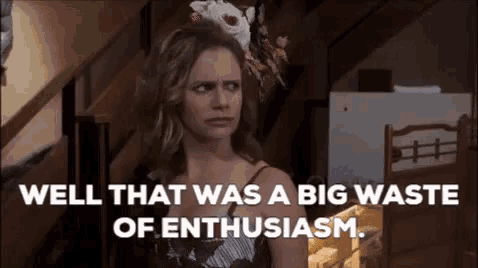 a woman with a flower in her hair is saying `` well that was a big waste of enthusiasm . ``