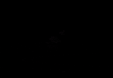 a man stands in front of a triangle shaped light