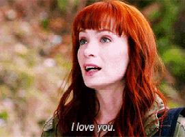 a woman with red hair and blue eyes says i love you