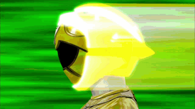 a yellow power ranger with a yellow helmet on
