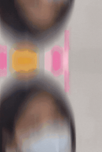 a blurred image of a woman wearing a mask