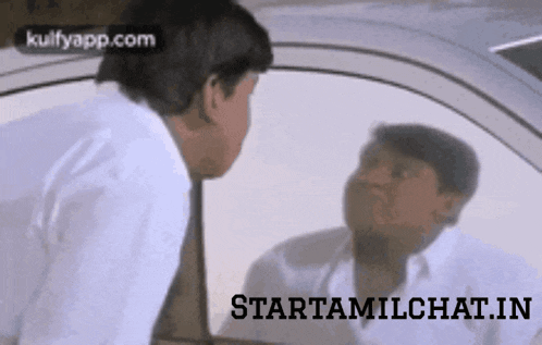 a man is looking at his reflection in a car window and says starttamilchat.in