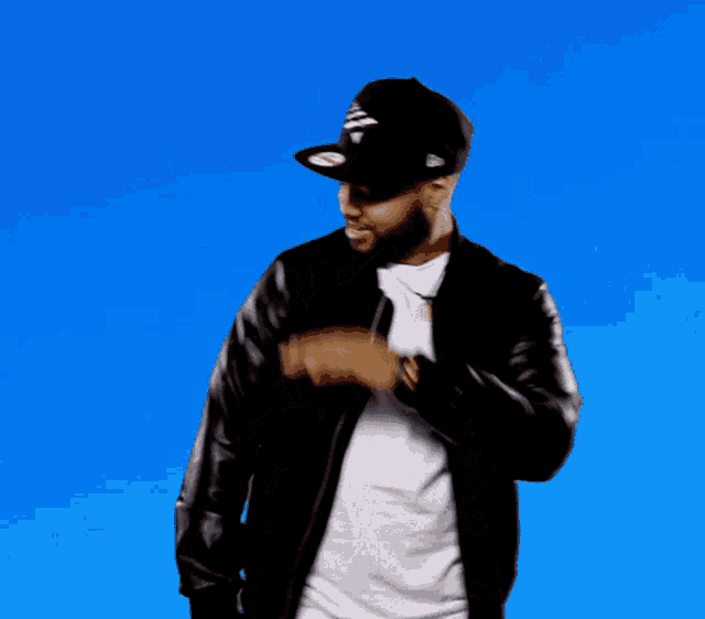 a man wearing a hat and a leather jacket