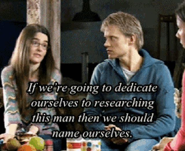 a group of people are sitting around a table with a quote that says if we are going to dedicate ourselves to researching
