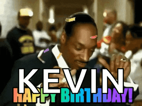 a man in a suit and tie is celebrating his birthday