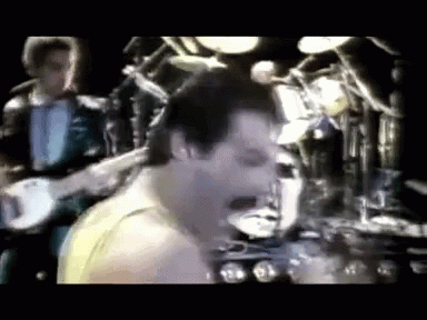 Freddie Mercury Queen GIF - Freddie Mercury Queen Signing GIFs