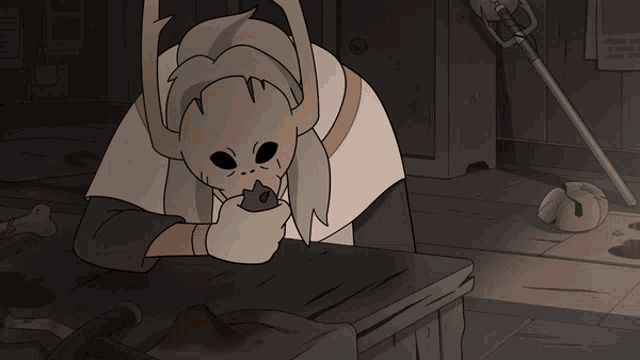 a cartoon drawing of a monster with horns and green eyes