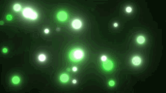 a bunch of green and white circles on a black background