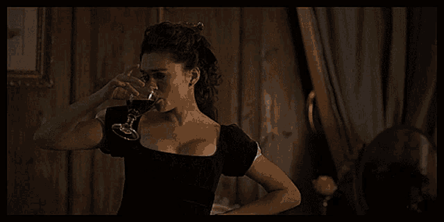 a woman holding a glass of wine with the words excuse me written above her