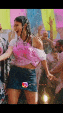 a woman is dancing in the rain wearing a t-shirt that says ' i am too ' on it