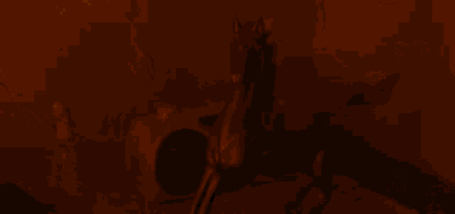 a close up of a woman 's face in a dark room with a red background .