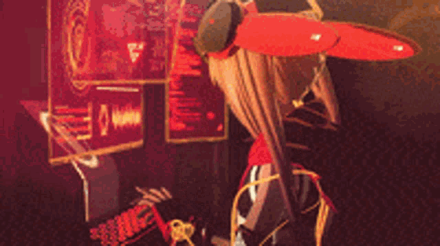 a girl with a red scarf around her neck is standing in front of a monitor