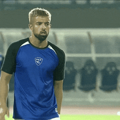 a man with a beard wears a blue shirt that says fff