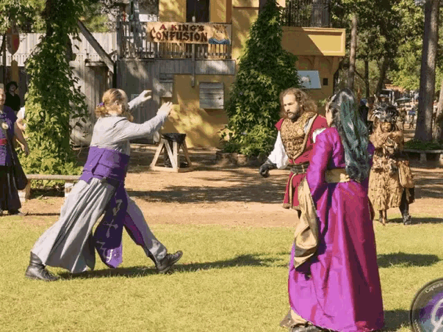 a sign that says a king 's confusion is in the background