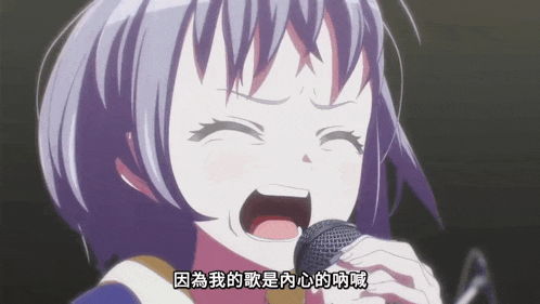 a girl is singing into a microphone with chinese writing on it