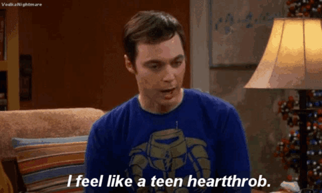 a man wearing a blue shirt says i feel like a teen heartthrob