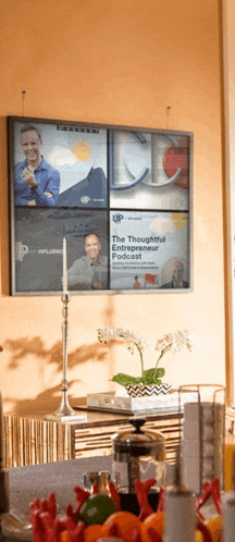 the thoughtful entrepreneur podcast is displayed on the wall above a table