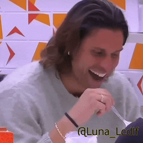 a man is laughing while holding a fork in his mouth with the name luna lcdlf below him