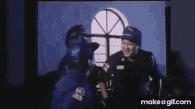 a group of police officers are standing next to each other in a room .