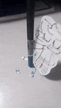 a piece of paper with a drawing of a cat on it is sticking out of a pencil