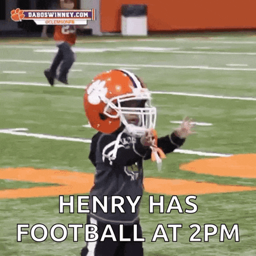 a little boy wearing a clemson football helmet says henry has football at 2 pm