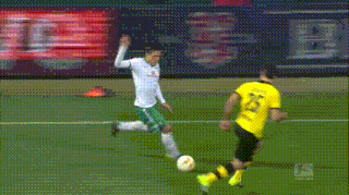 a soccer player wearing a yellow jersey with the number 24 on it