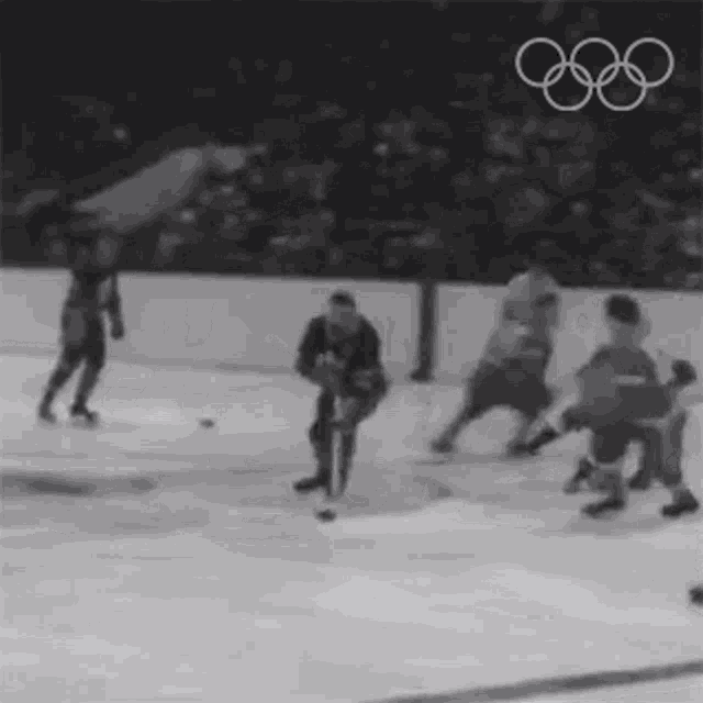 a black and white photo of a hockey game