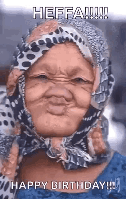 a woman wearing a head scarf is making a funny face .