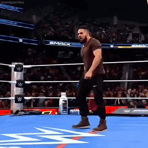 a man in a wrestling ring with the word smack on the ring