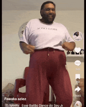 a man wearing a white shirt that says soso lobi is dancing