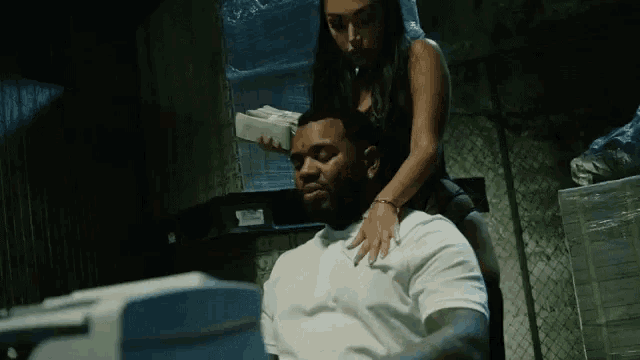 a woman is sitting on a man 's back holding money
