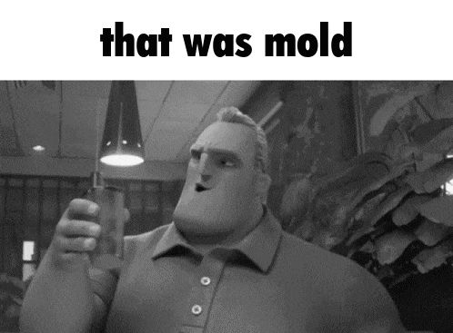 a black and white photo of a cartoon character holding a glass with the words `` that was mold '' above him .