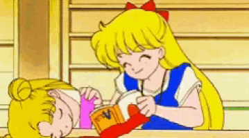 a cartoon girl with blonde hair is laying on another girl 's lap