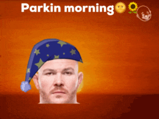 a man wearing a sleep hat with the words parkin morning written on it
