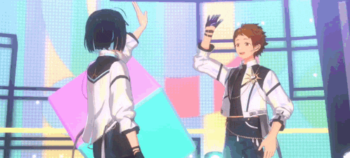 two anime characters are dancing on a stage .