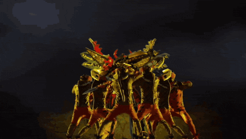 a group of people are dancing in a dark room with glowing lights behind them
