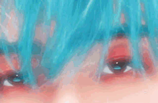 a close up of a person 's face with blue hair and hoop earrings